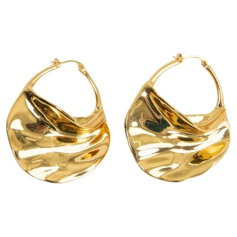 celine swirl hoops|Swirl large hoops in brass with gold finishing .